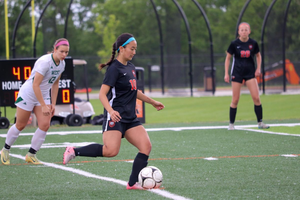 Nadia Kobayashi (10) of Ames prepares to take the kickoff during a game between Ames and Iowa City West on May 28.