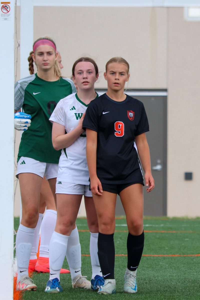 Ailie Goodman (9) of Ames waits for a corner kick.