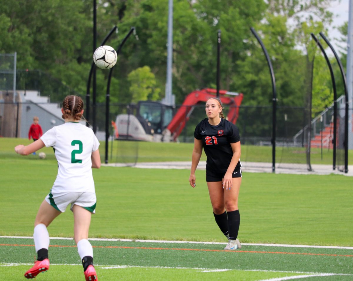 Addy Leto (21) of Ames takes a throw-in against Iowa City West.
