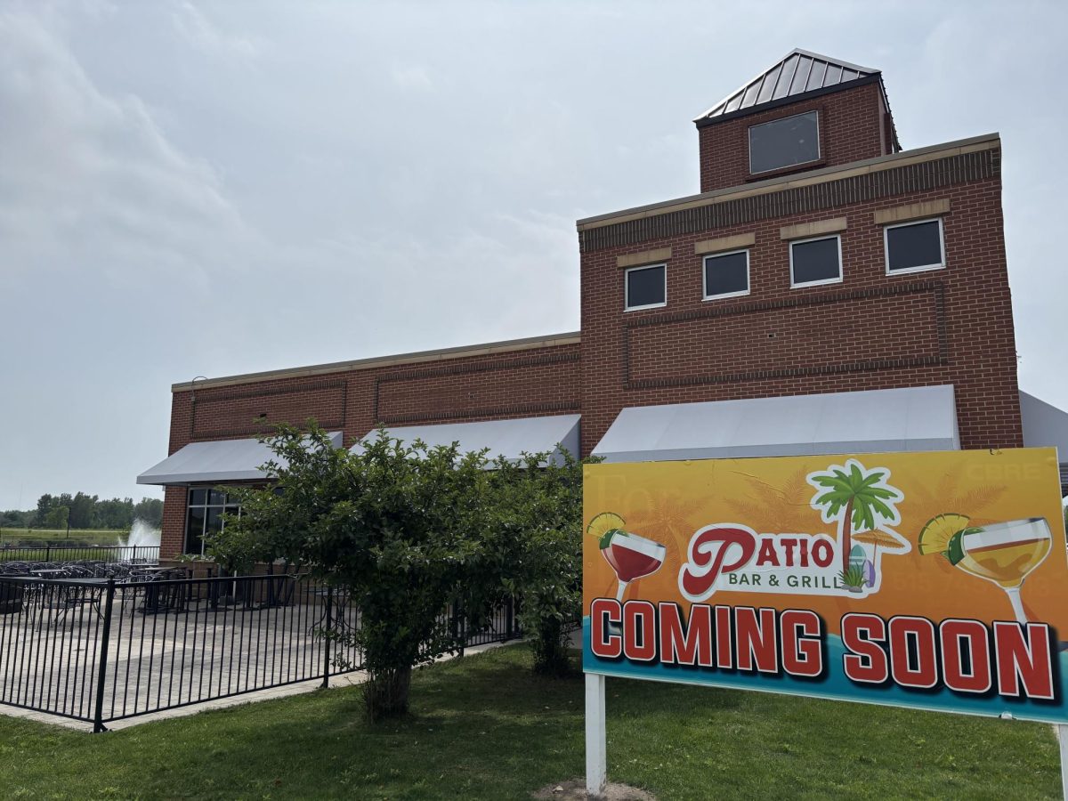 A sign in front of what used to be Mullet's shows a new restaurant, Patio Bar & Grill, will soon open in West Ames.