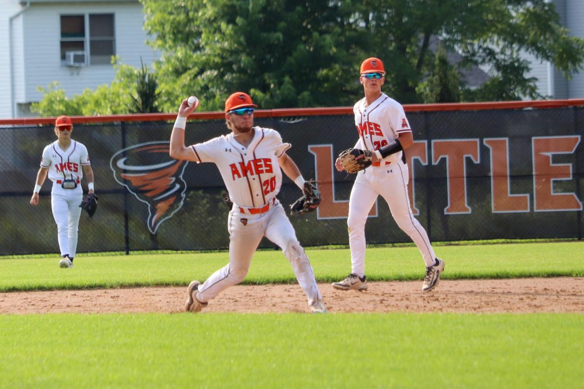 Charles Tucker (20) of Ames fires a pass to first base, where he successfully got a Railsplitter out.
