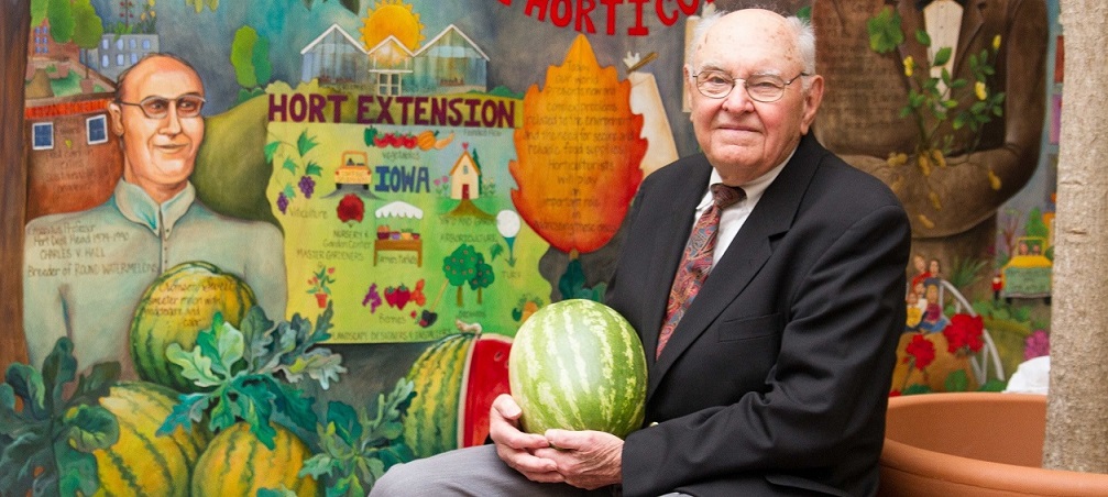 Charles Hall poses with a Crimson Sweet watermelon. (Provided by Iowa State University)