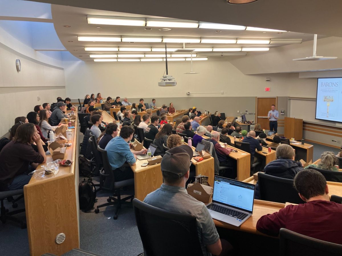 Austin Frerick, author Barons: Money, Power, and the Corruption of America's Food Industry, speaks to a group at the University of Iowa Law School in February 2025.