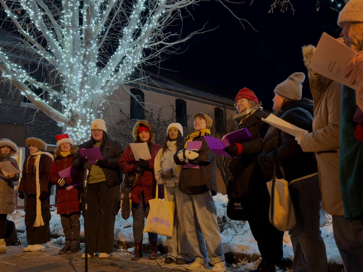 Count Me In, a treble-voice a capella ensemble from the Iowa State University Department of Music and Theatre performs at the Snow Magic Kick-off ceremony Thursday evening at Tom Evans Plaza on Main Street.