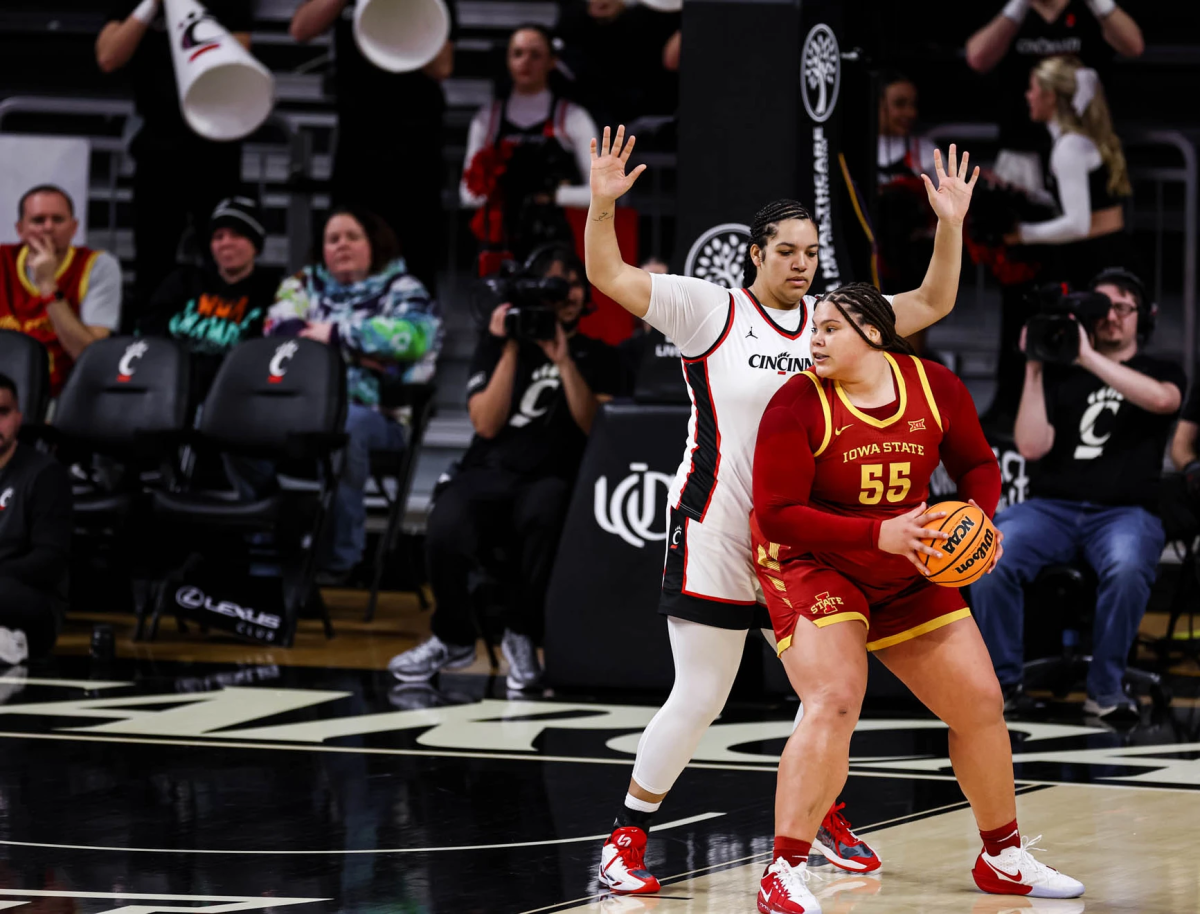Audi Crooks (55) of Iowa State looks to find her way into the paint against 6-6 Mary Carden of Cincinnati. (Photo: Matthew Grabher)