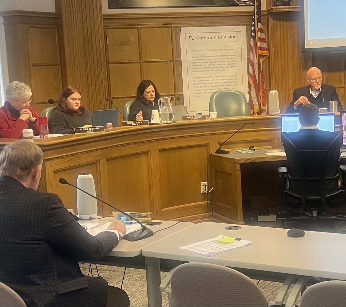 Ames City Manager Steve Schainker (foreground) and members of the city’s finance department began the process of reviewing  next year’s budget with the Ames City Council on January 30. Pictured at the council table are (from left) Reps. Gloria Betcher, Rachel Junck, Amber Corrieri and Mayor John Haila.