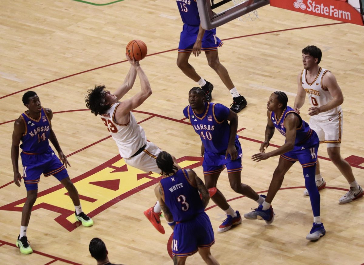 Blake Buchanan (23) takes an off balance field goal attempt during the first half against then No. 9 Kansas on Saturday. Buchanan made this and scored a total of 11 points.