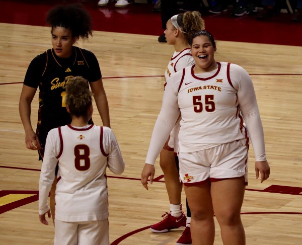 Cyclone center Audi Crooks (55) smiles during the first half against Arizona State on Wednesday. Crooks scored 28 points in the victory.