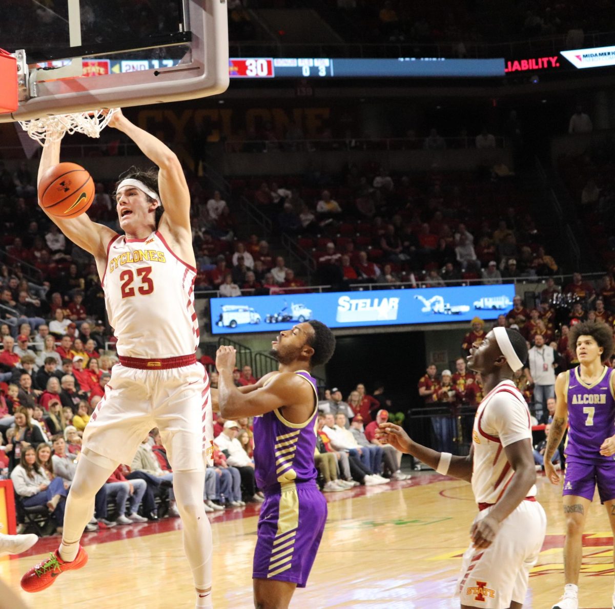 Blake Buchanan (23) of Iowa State dunks the ball.