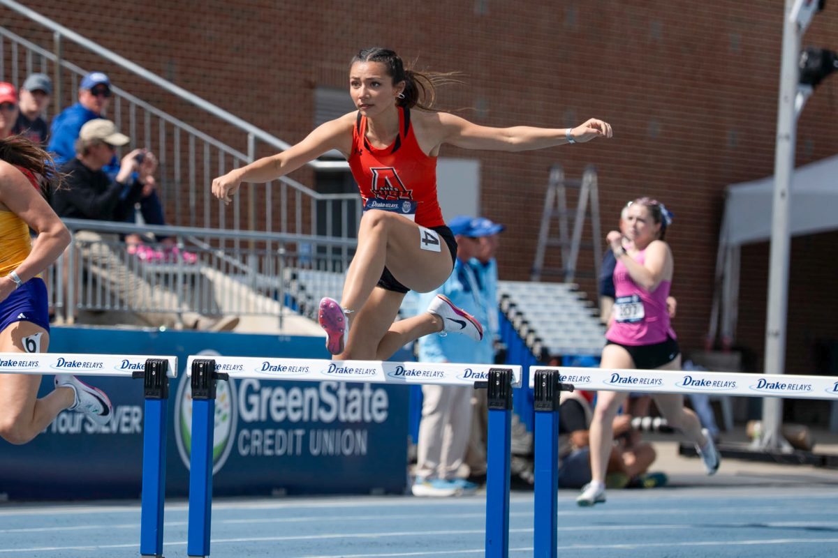 Ames High athlete Angelica Attinger competes in the the girls' 400-meter hurdles. She started off hot and finished winning her heat with a time of 1:02.43 at the Drake Relays on Saturday. Attinger finished second overall and less than a second behind the winner. (Photo: Zachary Quinn)