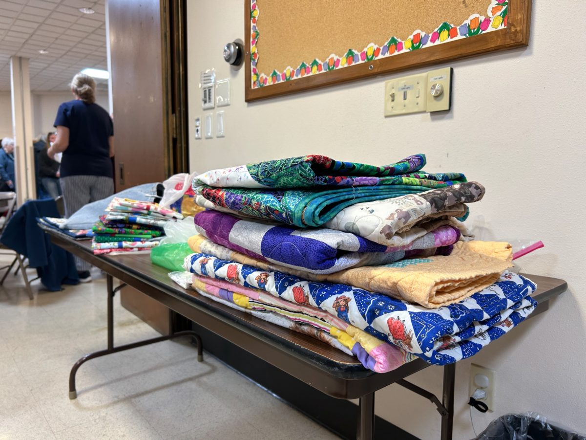 The Ames Quilt Guild gathers quilts to donate to area organizations at the First Methodist Church on March 26.