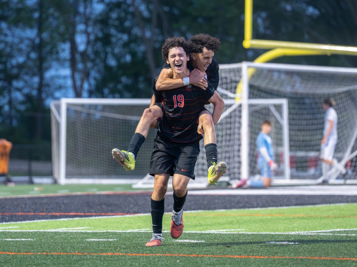 Ames athlete Samuel Sadow (19) celebrates after scoring the only goal for Ames in the match against Dallas Center-Grimes on Thursday at Ames High School.