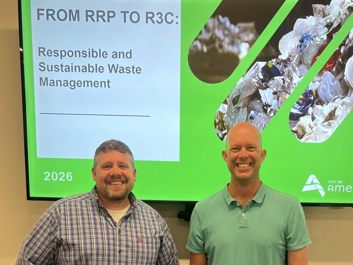 Mark Peebler, left, superintendent of the Ames Resource Recovery Plant, and Justin Clausen, public works director, spoke to an overflow crowd at Sixty Forward on Thursday.