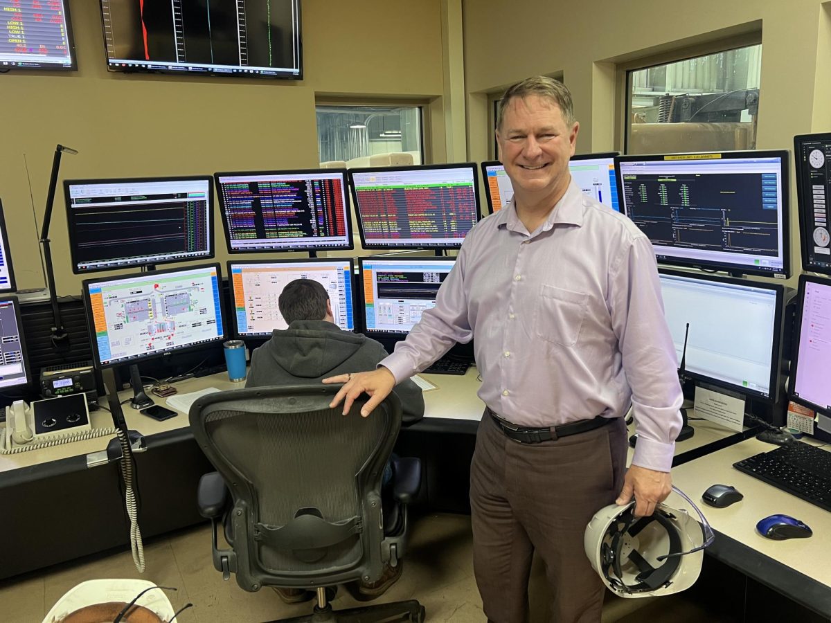 Director of Electric Services Donald Kom stands in the control room of the Ames Municipal Power Plant. 