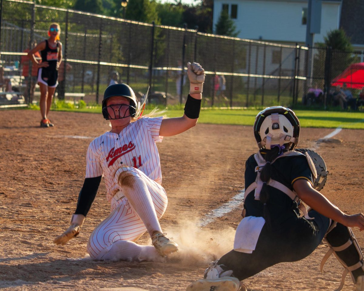 Mya Geffre (11) of Ames beats the tag by the Southeast Polk catcher for the lone Little Cyclone run of the evening.
