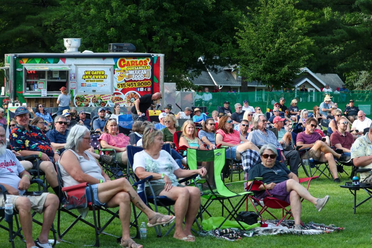 Attendees watching Cover That perform at Ames on the Half Shell. 
