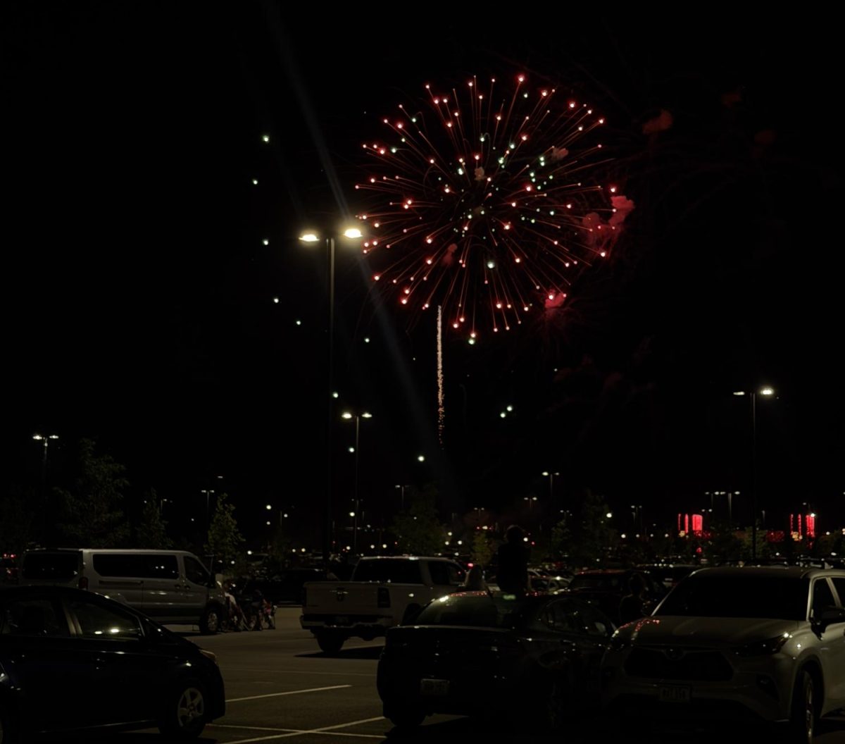 Residents gather to watch the Ames' fireworks display.