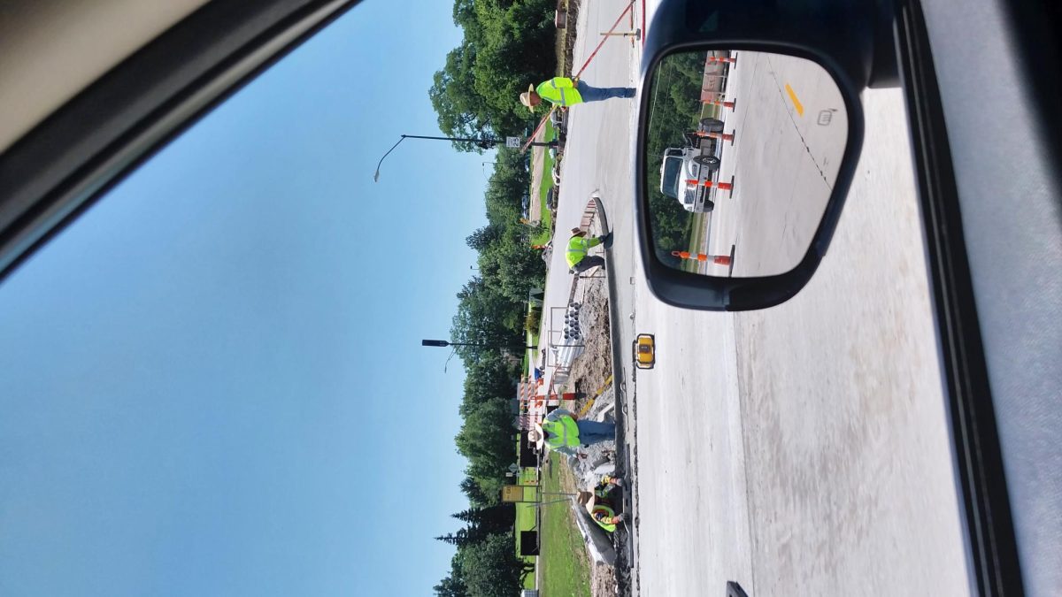 Construction crews work on South 16th Street. The project, which includes expanding the street to four lanes, is expected to be finished Aug. 21.