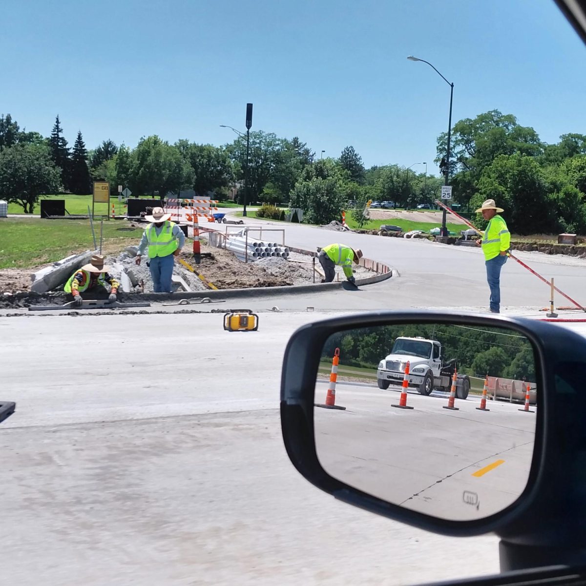 Construction crews work on South 16th Street. The project, which includes expanding the street to four lanes, is expected to be finished Aug. 21.